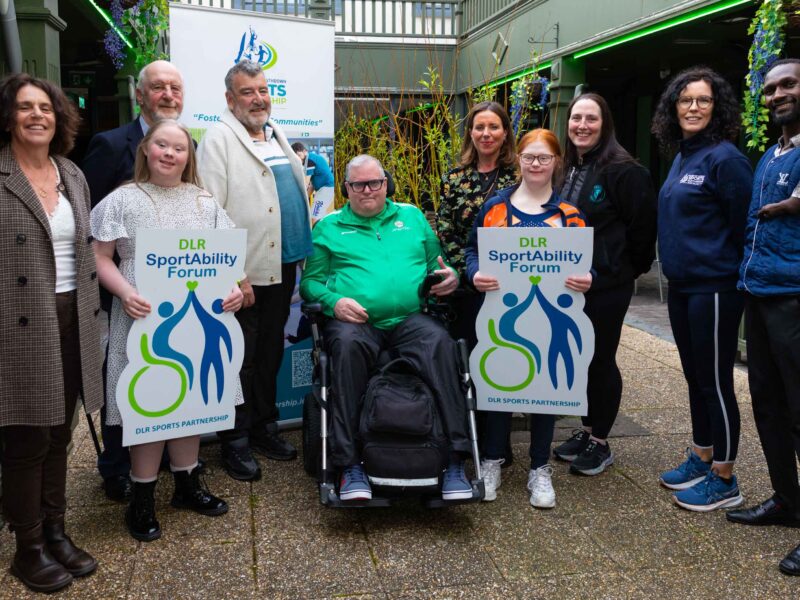Group shot of members and people with disabilities at the sports forum logo launch